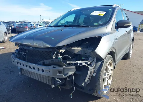 2014 Ford Escape Titanium z USA, uszkodzony, nr VIN 1FMCU9J94EUE34792